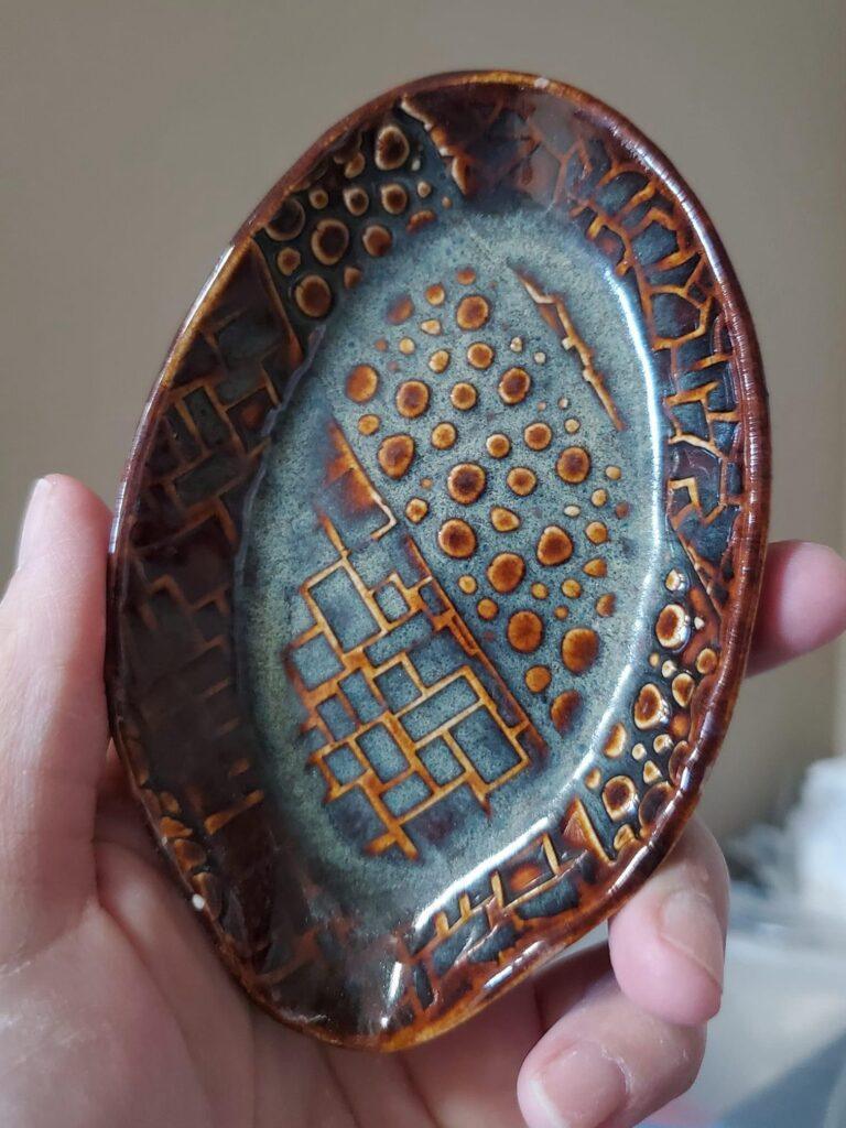 AMACO Iron Lustre on white stoneware plate by Keara Phillips Berlin