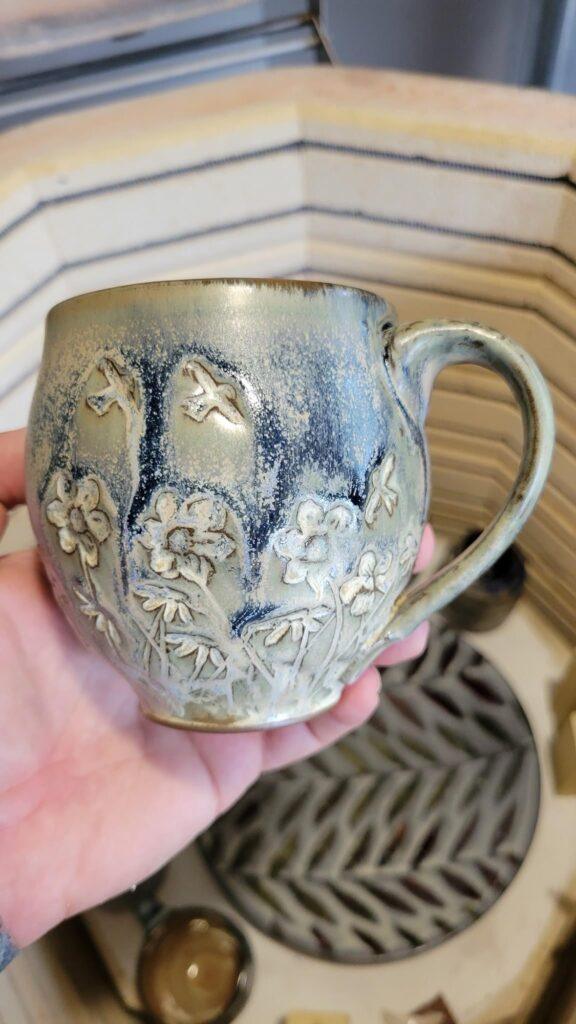 Mug wheel thrown by Brandon Christy, decorated with texture and covered by MAYCO Azurite and Himalayan Salt glazes and fired to cone 6