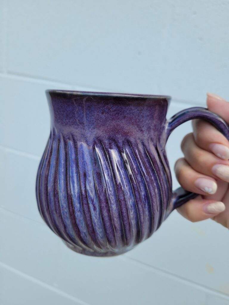 Stoneware mug glazwd with AMACO SmokeyMerlot over Obsidian. Artist - Elizabeth Campuzano